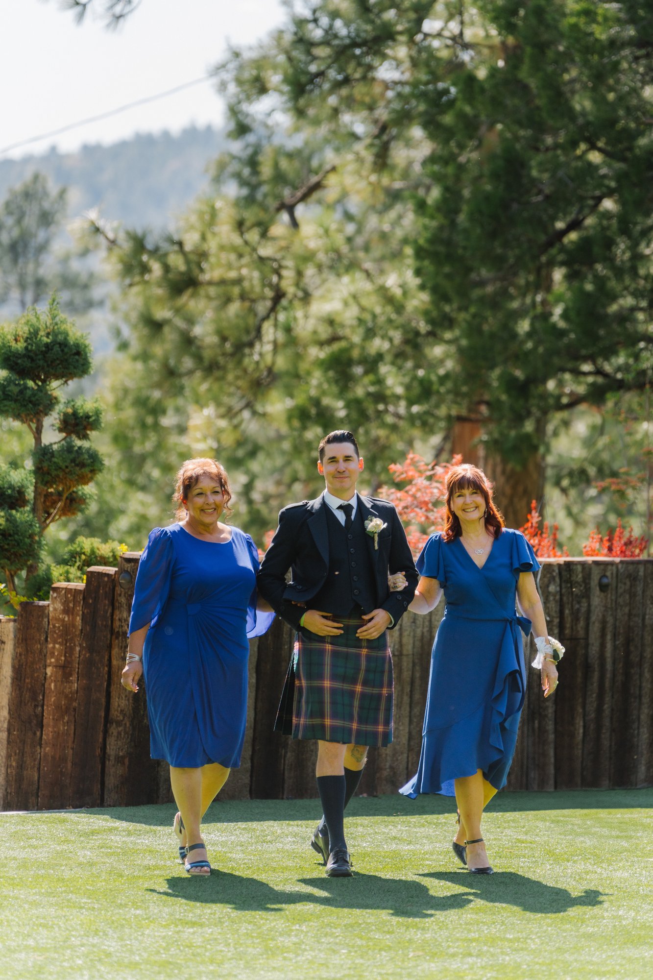 Mountain wedding processional — bride's mother and groom walking down the aisle at Tahquitz Pines, Idyllwild